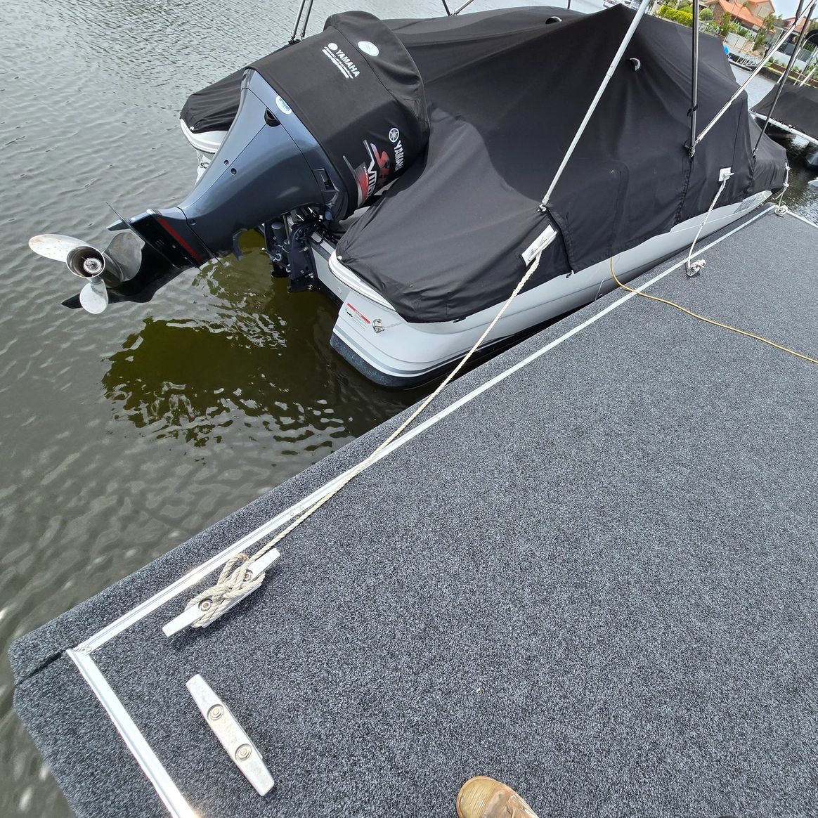Boat moored alongside fender-protected Gold Coast pontoon